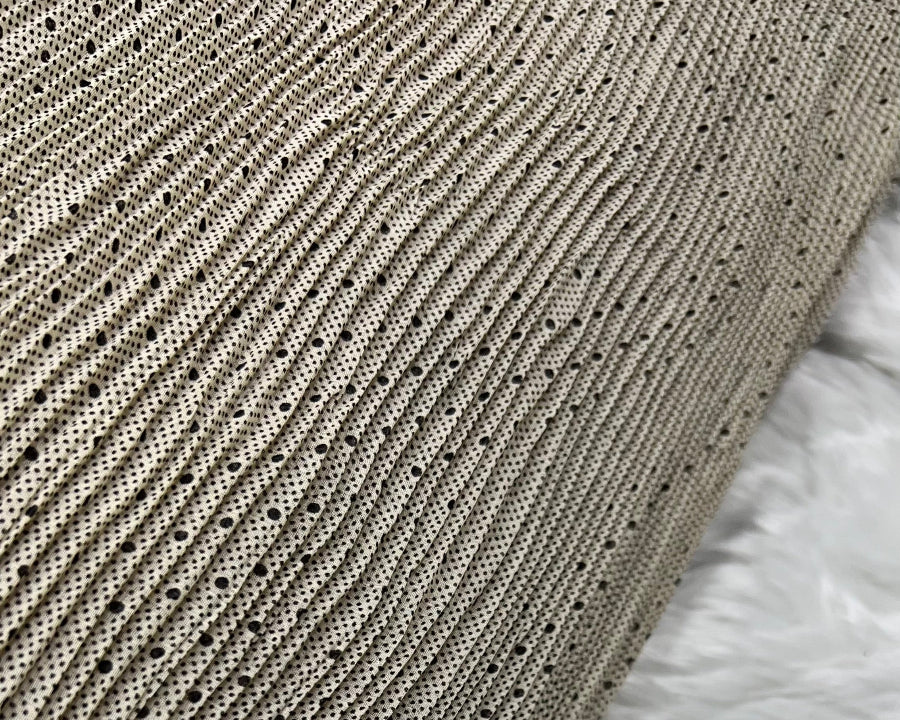 Close-up of a textured fabric with a patterned surface